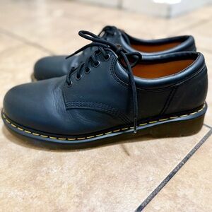 Classic Black Dr. Martens Leather Lace-Up Shoes with Yellow Stitching